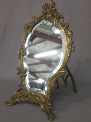 An Art Nouveau style bevelled plate easel mirror contained in a gilt metal frame 18"