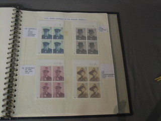A blue album containing a 1971-74 collection of stamps, traffic lights etc