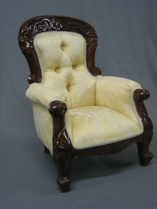 A Victorian style mahogany show framed childs chair upholstered in yellow material, raised on cabriole supports