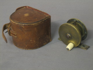 A Farlow brass fishing reel with ivory handle marked Charles Farlow & Co Makers 191 Strand, London 2" contained in a leather case