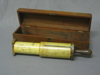 A calculating stick contained in a mahogany case 16"