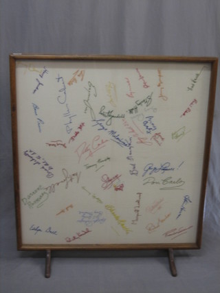 An autographed fire screen containing various signatures embroidered over pen/pencil including Liberaci, Bing Crosby, Felicity Kendle, Margaret Lockwood, Jerry Black, Johnny Harris, Robert Roberts and many others 34" x 41"