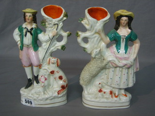 A pair of 19th Century Staffordshire splat back vases in the form of Shepherd (f) and Shepherdess 9" 