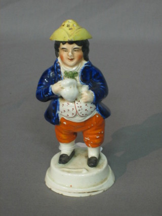 A Staffordshire pepperette in the form of a standing Toby Philpot with pint of beer 6" (hat chipped)