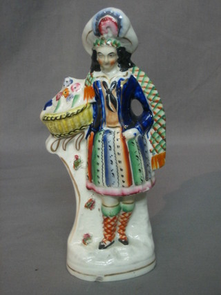 A 19th Century Staffordshire figure of a standing Scots lass 9" (chip to base)