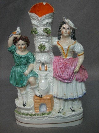 A 19th Century Staffordshire flat back spill vase decorated mother and daughter 10" (chipped and cracked to top)