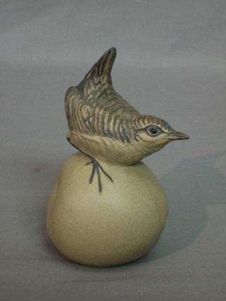 A Poole Pottery figure of a seated Wren on an apple, base incised LL 5"