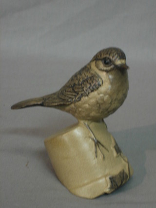 A Poole Pottery figure of a seated Robin on an upturned flower pot, base marked LTJ 5"