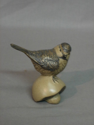 A Poole Pottery seated figure of a bird on a mushroom 3"