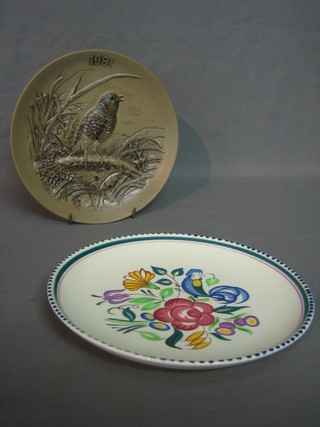 A Poole Pottery limited edition 1981 Christmas plate 8" and a circular Poole Pottery plate with floral decoration 9"