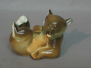 A Soviet Russian porcelain figure of a reclining brown bear 3"