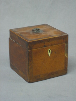 A 19th Century square mahogany tea caddy with feather crossbanding, line inlay and hinged lid 5" 20-30