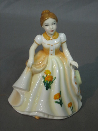A Royal Doulton figure Pretty Lady, Flower Girl October