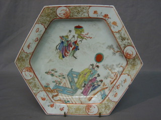 An Oriental octagonal porcelain plate decorated court figures (chip to rim) 10"
