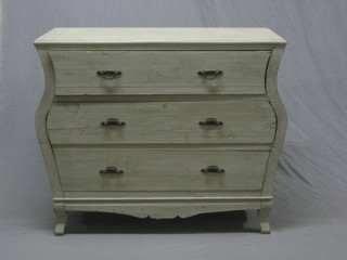 A Continental style grey painted commode of serpentine outline fitted 3 long drawers, raised on bracket feet 41" 