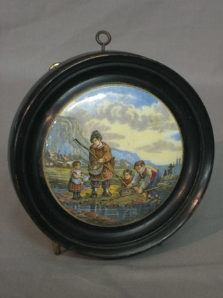 A 19th Century Prattware pot lid decorated a shrimping scene 4" contained in an ebonised socle frame 4"
