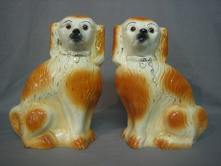 A pair of Staffordshire style figures of seated dogs 13"