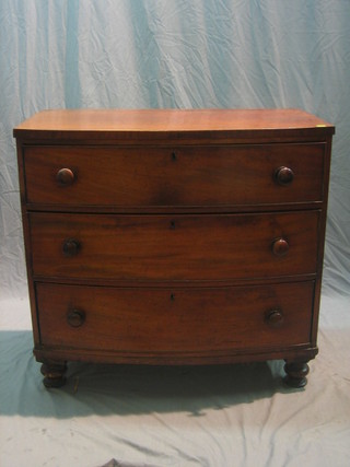 A 19th Century mahogany bow front chest of 3 long drawers 35"