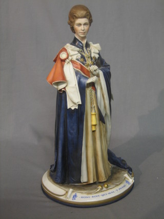A Capo di Monte figure in the form of Queen Elizabeth II wearing the mantle of the Order of the Garter 15"
