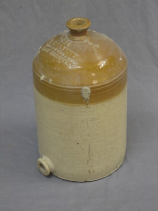 A stoneware flagon marked 124 Travett, importers of wines and spirits East Grinstead