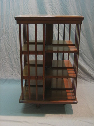 An Edwardian square mahogany revolving bookcase 24"