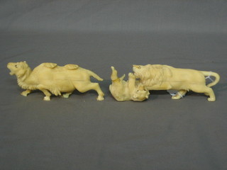 A carved ivory figure of a lion encountering a bear 6" (f and r) and 1 other of a camel (f and r)