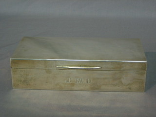 A silver cigarette box with hinged lid, London 1961, 8"