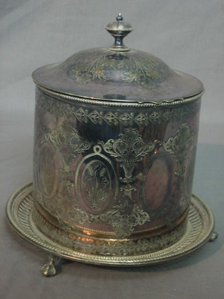 A circular silver plated biscuit barrel