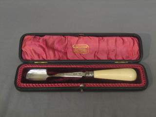 A silver stilton scoop with turned ivory handle, Sheffield 1909, cased
