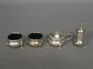 A 4 piece silver condiment set with pair of salts, mustard and pepper pot, Birmingham 1923, 3 ozs