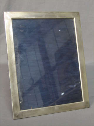 A plain silver easel photograph frame 11" x 8 1/2"