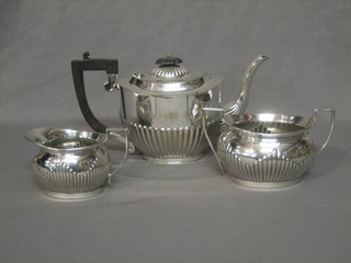 An oval silver plated 3 piece tea service with teapot, sugar bowl and cream jug, with demi-reeded decoration