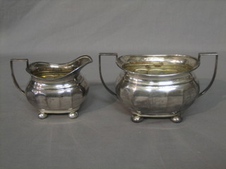 A Georgian style silver plated twin handled sugar bowl and cream jug