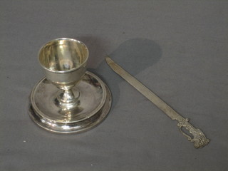 A silver egg cup, Birmingham 1919 and an Eastern silver paper knife in the form of a Scimitar