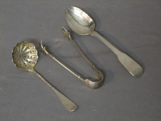 A Georgian Irish silver fiddle pattern teaspoon, Dublin 1803, a pair of silver sugar tongs and a silver sifter spoon