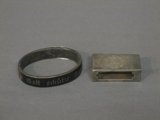 A silver and black enamelled mourning bracelet, together with a Continental silver match slip (2)