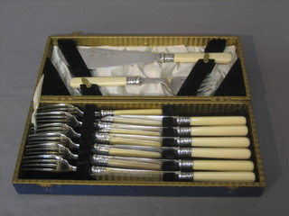 A cased set of 6 silver plated fish knives and forks with servers