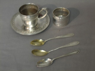 A Continental silver christening set with coffee can and saucer, napkin ring, spoon and 2 small spoons