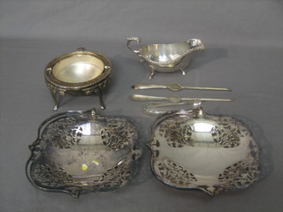 A pair of silver plated cake baskets with swing handles, a Georgian style sauce boat, a pair of lobster picks, a pair of sugar tongs and a roll top butter dish