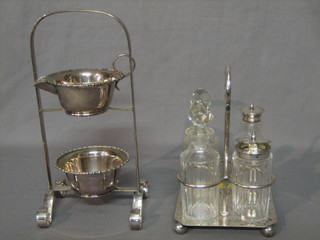 A silver plated cream and sugar bowl raised on a stand and a silver plated 4 bottle condiment set