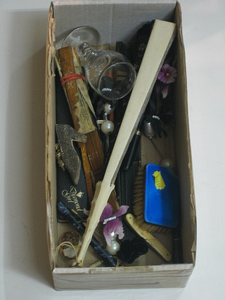 A silver and blue enamelled back childs hair brush, an antique glass, 3 fans, a small collection of fountain pens, a barrel tape measure, a small collection of costume jewellery, cloak pins etc