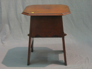 An Art Nouveau octagonal mahogany table, fitted a deep drawer and raised on standard end supports 21"