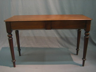 A Victorian mahogany hall table, fitted a frieze drawer and raised on turned and fluted supports 47"
