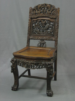 A Chinese pierced and carved Padouk chair raised on club supports
