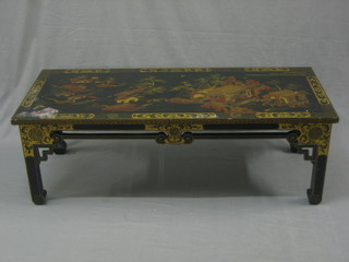 A Chinese rectangular lacquered occasional table decorated Pagodas and scenes of Chinese life,  raised on square supports 47"