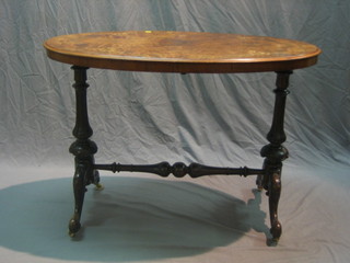 A Victorian inlaid figured walnut oval stretcher table, raised on turned supports with H framed stretcher 41"