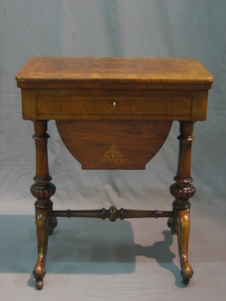 A Victorian inlaid figured walnut work table with card table top, fitted 1 long drawer with deep basket, raised on turned supports united by an H framed stretcher 24"