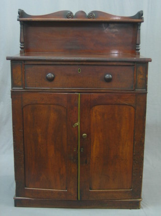 A William IV mahogany chiffonier with raised back, the base fitted a drawer above a double cupboard, raised on a platform base 31"