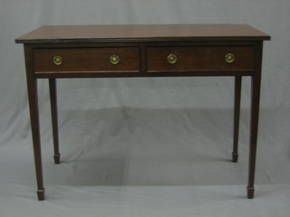A Victorian mahogany side table fitted 2 long drawers raised on square tapering supports ending in spade feet 41"