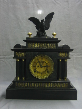 A 19th Century American 8 day striking mantel clock with gilt chapter ring and Roman numerals with visible escapement, contained in a black marble architectural case and surmounted by a figure of an eagle with wings outstretched